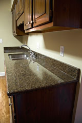 quartz kitchen countertop and wood cabinets
