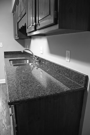 quartz kitchen countertop and wood cabinets