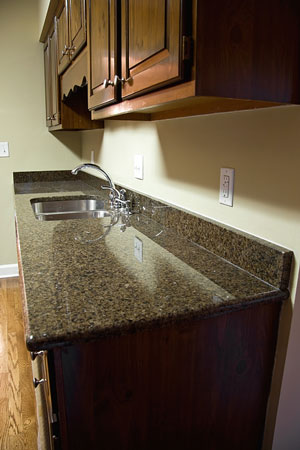 quartz kitchen countertop and wood cabinets